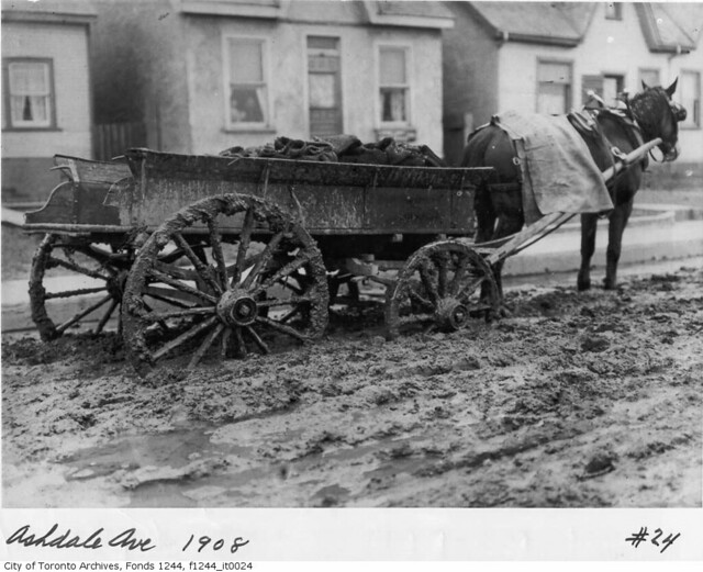 For millennia draft animals have assisted in material handling. This horse-drawn coal wagon stalled on muddy Ashdale Ave. Photo: William James, 1908, from the City of Toronto Archives.